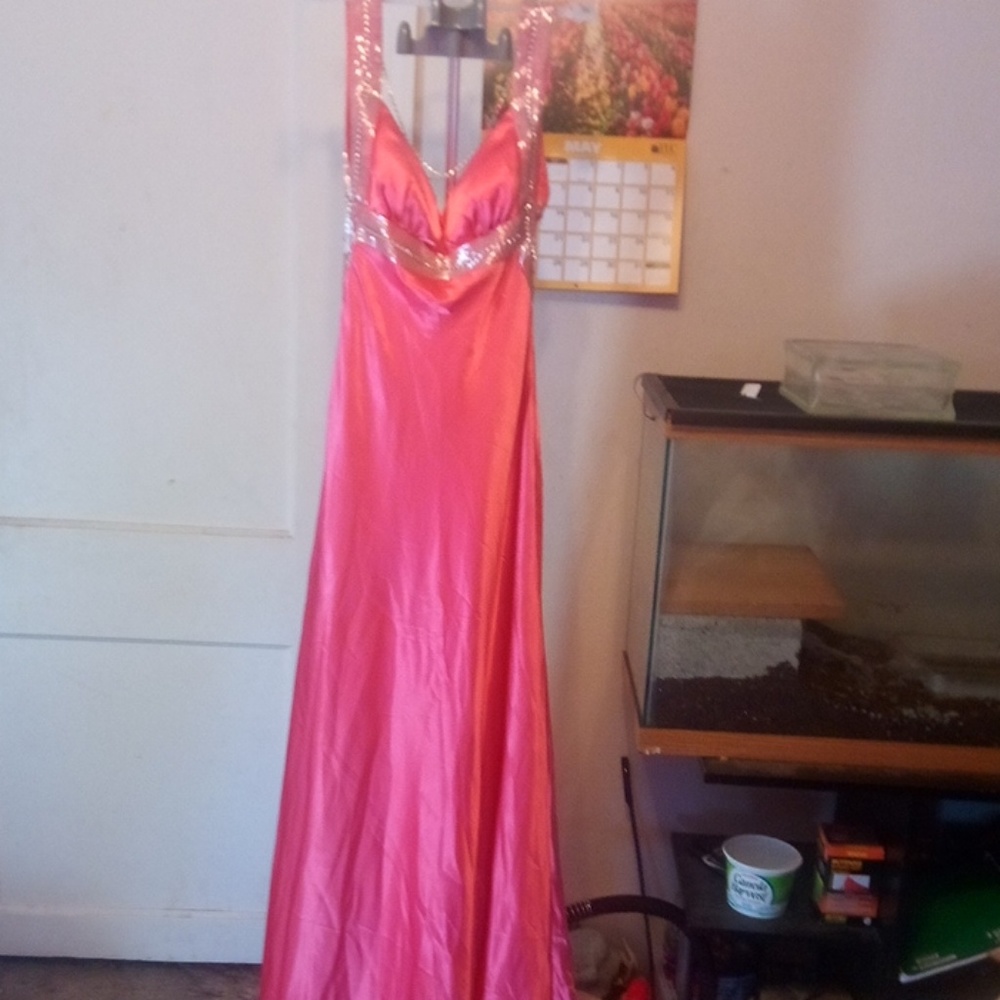 Silky peach colored prom dress.